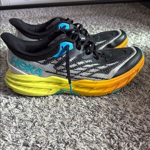 Hoka Running Shoes with Yellow and Black Accents